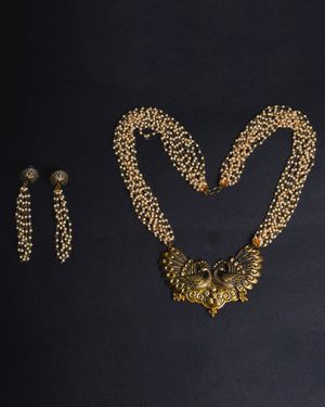 The Lavish Layers of Elegance – Golden Multilayered Pearl Neckpiece