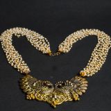 The Lavish Layers of Elegance – Golden Multilayered Pearl Neckpiece